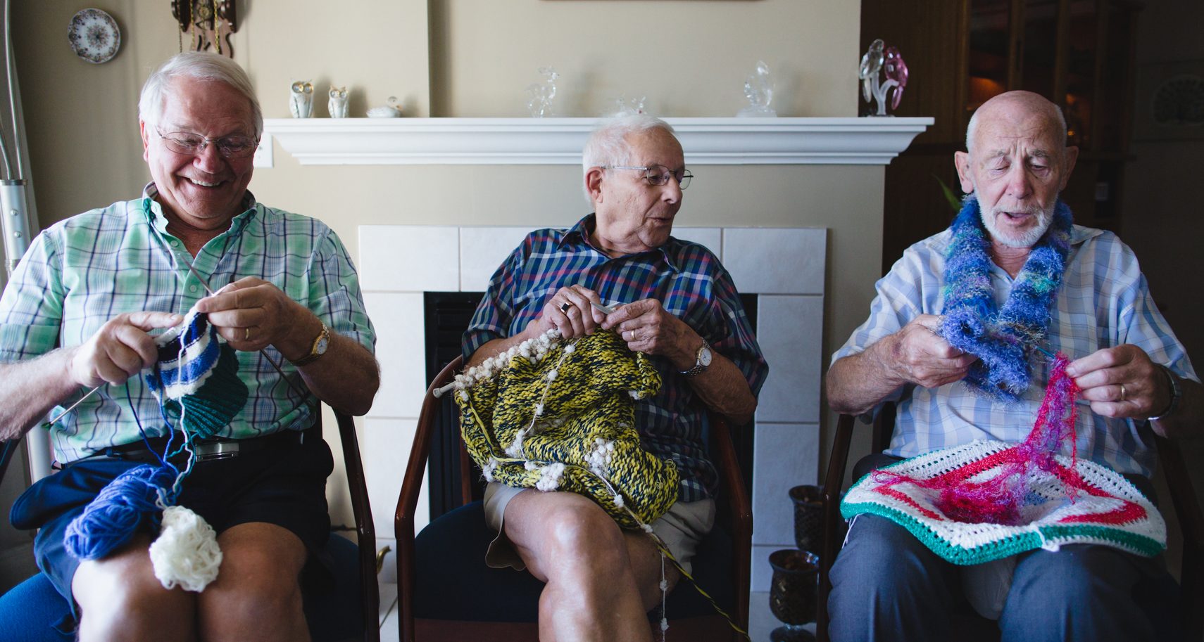 Group of senior men knitting together